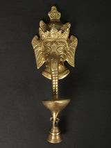 Ganesha face wall mask with brass diya cup and bell pull, gold finish