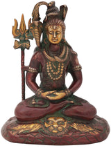 Red and green seated Shiva idol holding trident, ornate brass statue, 10-inch