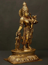 Brass Parvati with sons figures beside her, raised trident and crown details.