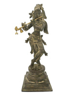 Antique green brass statue of standing Lord Krishna playing flute, full figure