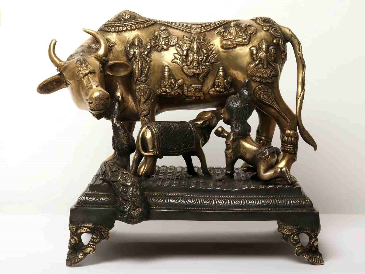 Bronze-gold cow and calf statue with baby Krishna, ornate carvings, 15 in