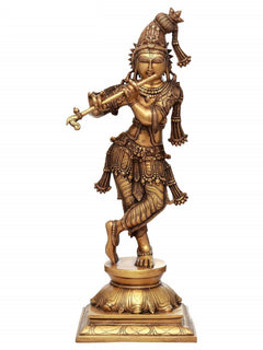 Krishna brass flute-playing statue with ornate crown and jewelry on pedestal