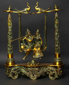 Greenish gold brass Radha Krishna statue on peacock swing with hanging chains