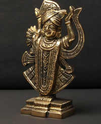 Brass Shrinathji idol, front view with detailed jewelry and draped garments