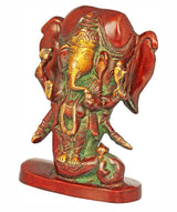 Ganesha idol from side view, elephant head and hands holding small items