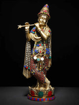 Lord Krishna flute statue on lotus pedestal, ornate gold with jeweled details