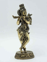 AONA brass Krishna statue playing flute, detailed headgear and flowing garments on pedestal