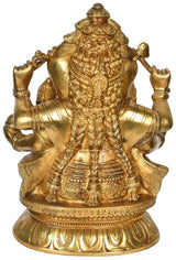 Brass Ganesha statue, seated with raised arms and detailed carved ornamentation