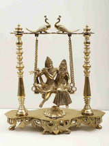 Handmade brass Radha-Krishna swing statue with peacocks, 15-inch base