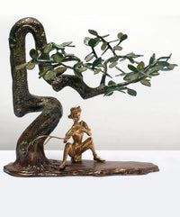 19-inch brass Krishna flute statue under tree with sculpted green-leaf branches