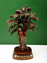 Brown and natural brass Krishna with Radha under an ornate tree sculpture, 12.5 cm