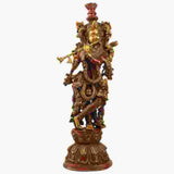 Handmade brass Murli Krishna statue, red accents, ornate crowned figure holding flute
