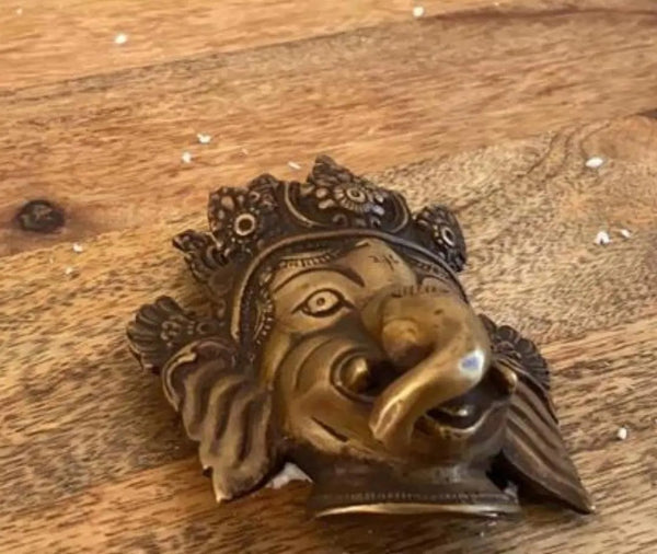 Handmade small brass wall hanging mask of Lord Ganesha 4 inches Entryway Setting