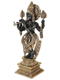 Black brass Krishna idol in tribhanga pose, detailed arm ornaments and draped waist, 15 cm