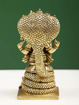 Back view brass Ganesha statue with five serpent hoods behind, seated, 4 in