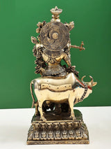 Back view of handmade brass sculpture: Murlidhar Krishna with cow, engraved details, 16 inches