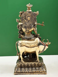Back view of handmade brass sculpture: Murlidhar Krishna with cow, engraved details, 16 inches