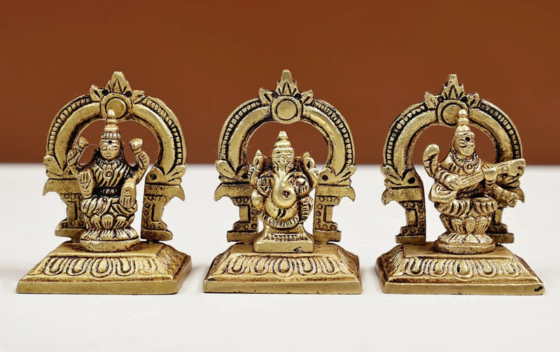 Set of three small brass statues of Ganesha, Lakshmi, and Saraswati 2 inches