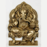 Natural brass Lord Ganesha idol seated on a throne, 11 inch