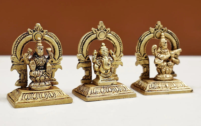 Set of three small brass statues of Ganesha, Lakshmi, and Saraswati 2 inches