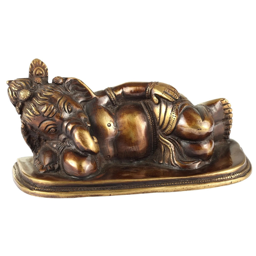 Antique handmade brass Ganesha statue, relaxing pose with ornate trunk and belly
