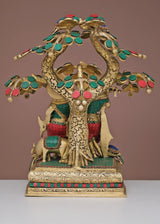 Brass Radha Krishna sculpture with arched tree canopy and floral ornaments on pedestal base