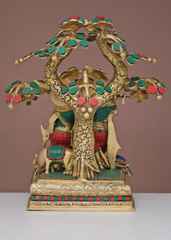 Brass Radha Krishna sculpture with arched tree canopy and floral ornaments on pedestal base