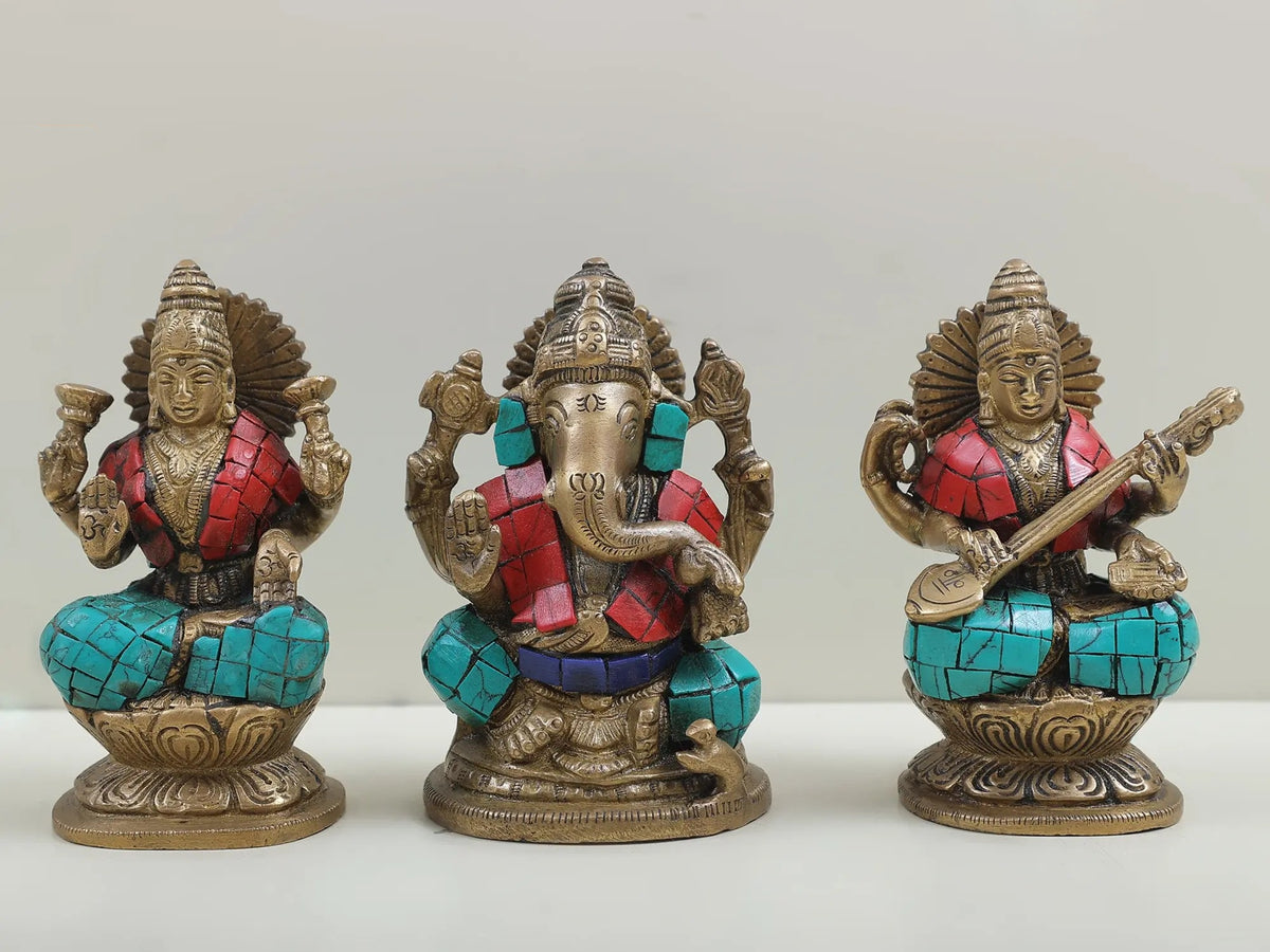 Inlaid brass trio idol of Saraswati, Ganesha, and Lakshmi, seated on lotus, 4 in