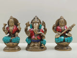 Inlaid brass trio idol of Saraswati, Ganesha, and Lakshmi, seated on lotus, 4 in