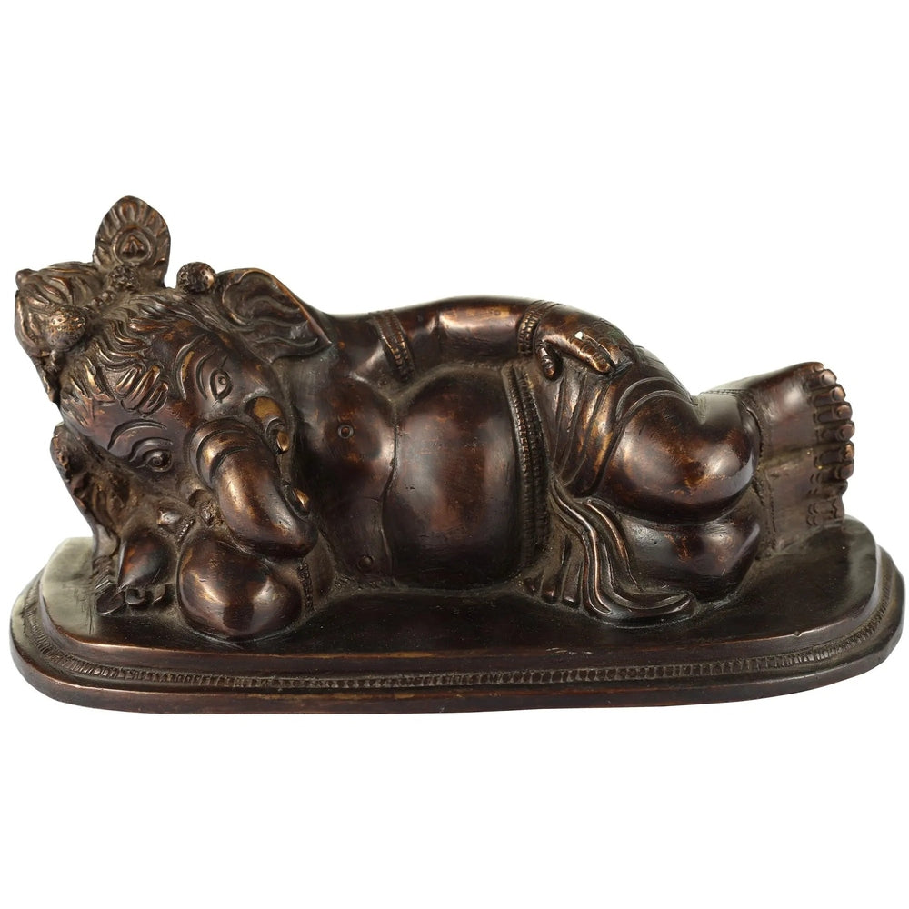 Antique brass Ganesha relaxing statue with intricate carved details, 6 inch