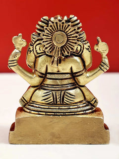Small brass Ganesha statue, sunburst halo back view, raised arms on pedestal base