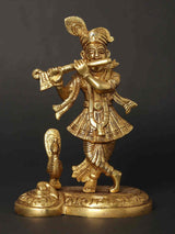 Small Lord Krishna statue playing flute, peacock-feather motif, gold finish, 6 inches