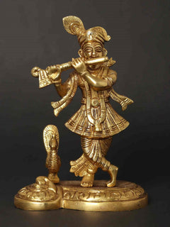 Small Lord Krishna statue playing flute, peacock-feather motif, gold finish, 6 inches