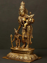 Brass Parvati statue holding Ganesha and Karttikeya, ornate jewelry and halos.