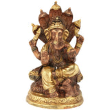 Small Ganesha brass sculpture seated on Shesha Naga, brown-gold finish, 5 inches