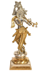 Handmade brass Krishna statue playing the flute, side view with ornate draped details