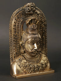 AONA brass Lord Shiva head idol with kirtimukha, detailed facial features, arched frame