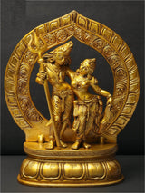Shiva & Parvati brass statue with ornate halo; Shiva holds trident