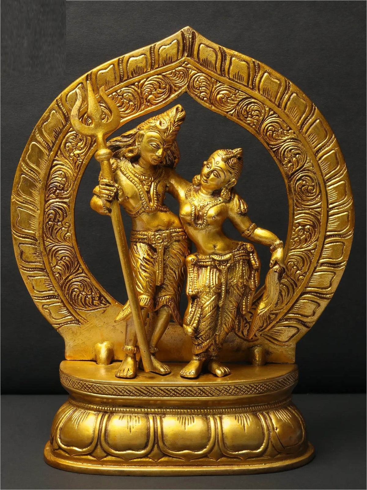 Shiva & Parvati brass statue with ornate halo; Shiva holds trident