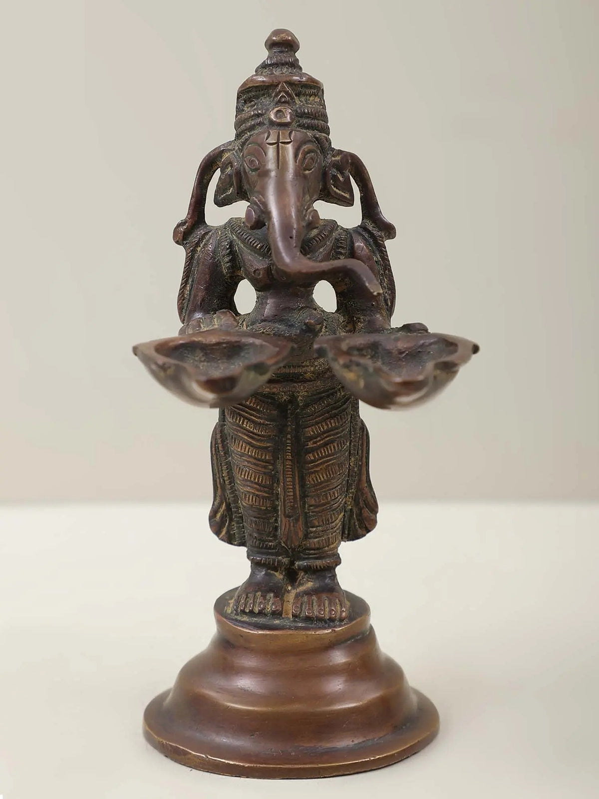 5-inch brass Ganesha twin lamp figurine, two hands holding flared lamp trays