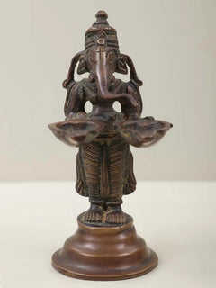 5-inch brass Ganesha twin lamp figurine, two hands holding flared lamp trays