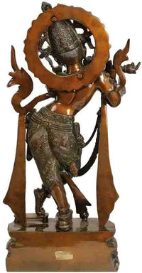 Brass statue of flute-playing Krishna with halo ring, long draped garment and detailed sandals