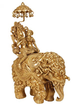 Natural brass Radha and Krishna on elephant figurine with raised umbrella detail