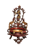 Handmade brass urli with Lord Krishna, ornate arch, and two animal side figures