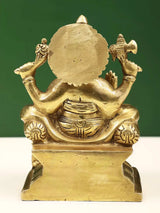 Back view of brass Ganpati statue, seated with carved ornaments on base, 5 in