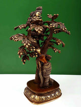Natural brass Krishna figure above Radha beneath detailed tree, brown base, 12.5 cm