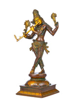 Brass Lord Krishna cosmic form statue with raised arm, standing on pedestal base