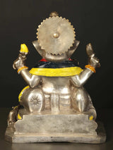 Back view of brass Lord Ganesha statue with yellow sash and seated torso base