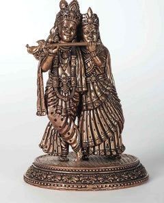 AONA small rose-gold brass Radha-Krishna statue, front view with flute