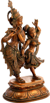 Dancing Radha and Krishna brass statue, curved poses, ornate detailing, oval base